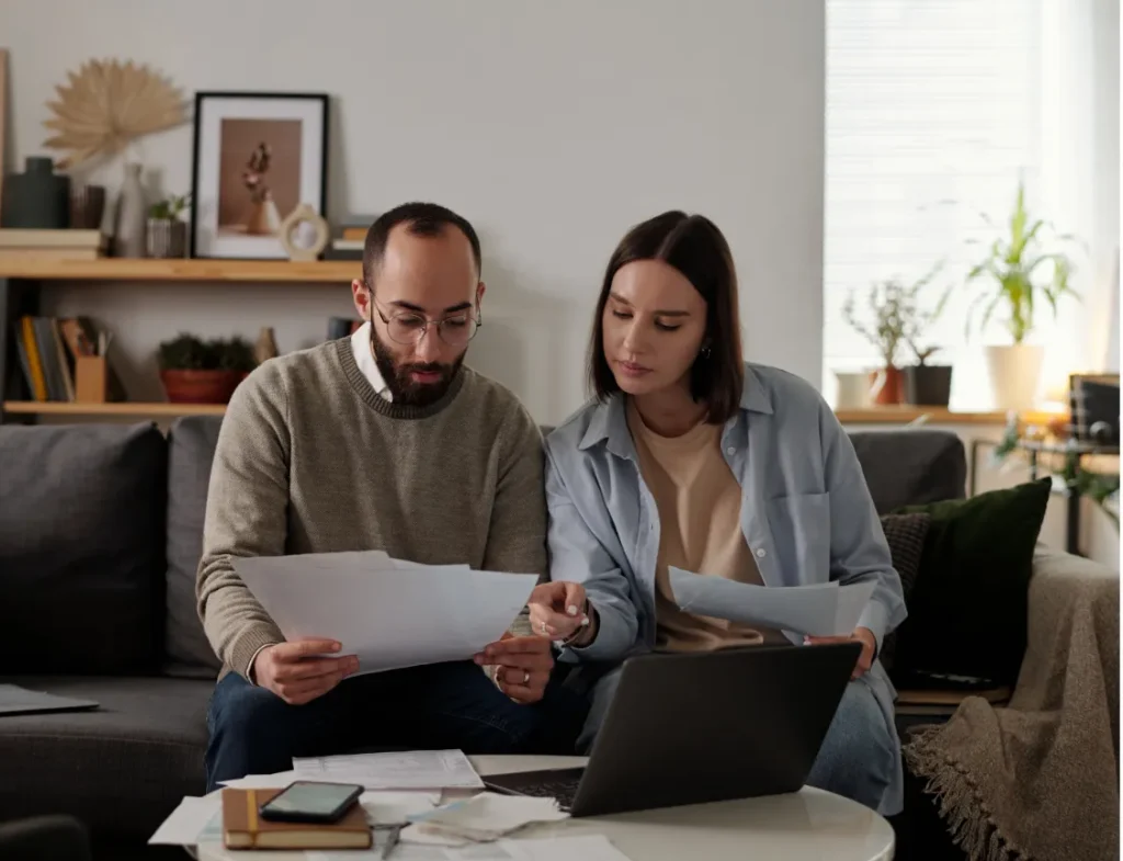 Client reviewing documents and discussing refinancing options with a mortgage broker in Perth WA.