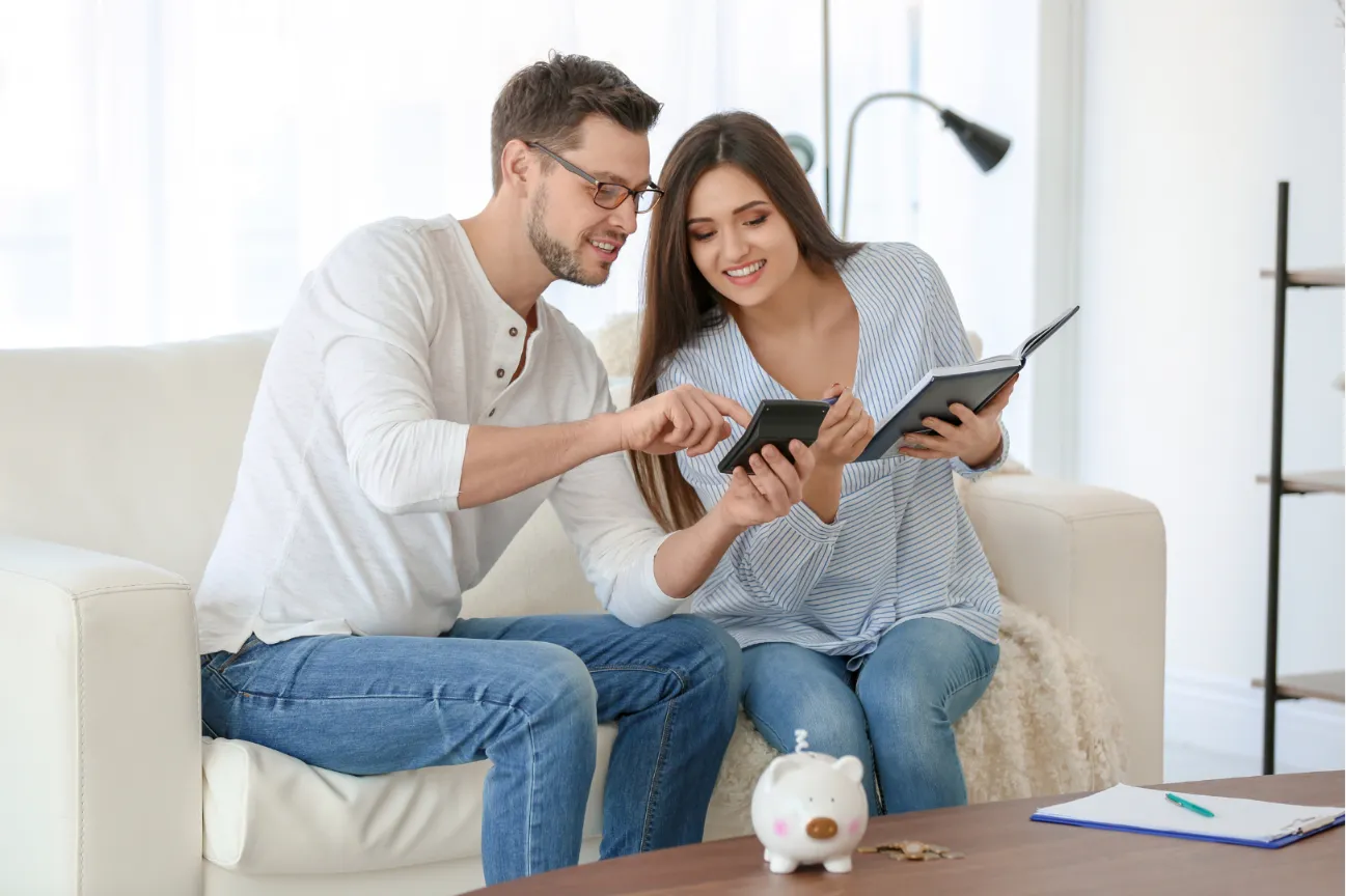 Couple calculating their budget and savings for a home loan in Perth